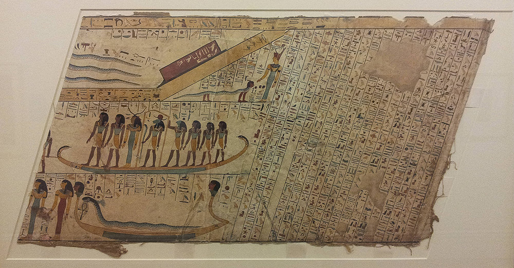 Depiction of the underworld, with gods standing in large boats and hieroglyphs in diagonal columns