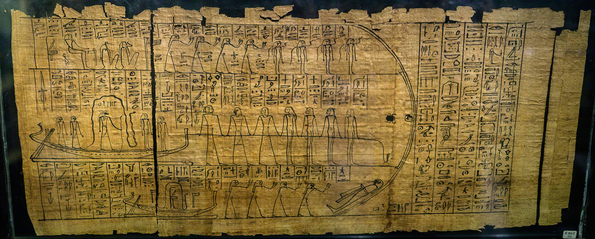 Black ink on papyrus. There are three registers with netherworld deities/demons drawn in a cursive, stick-figure-like manner. They are surrounded by hieroglyphs