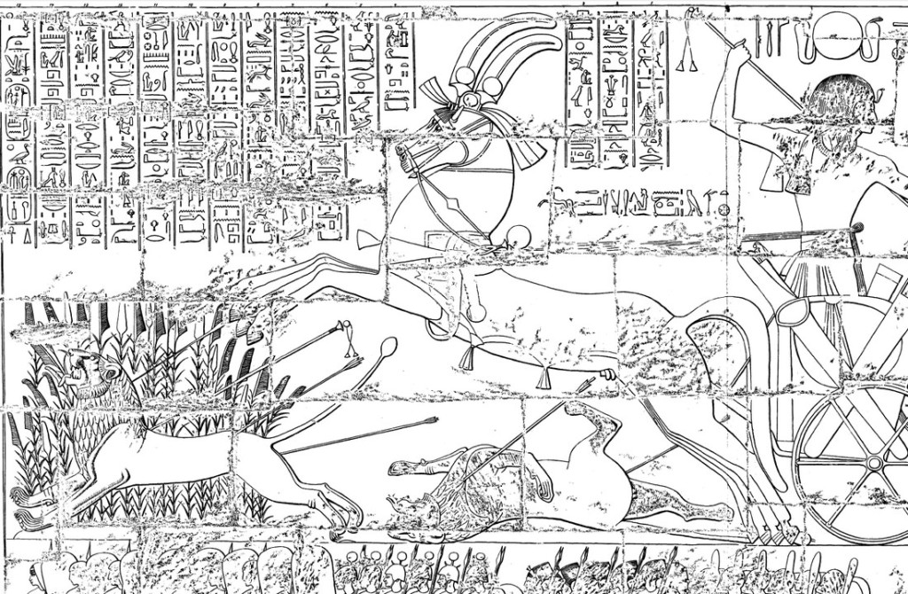 A line drawing of the scene, which has Rameses in a horse-drawn chariot hunting lions using a bow and arrow. A lion is running past a large bunch of flowering reeds. There are hieroglyphic inscriptions above the scene.