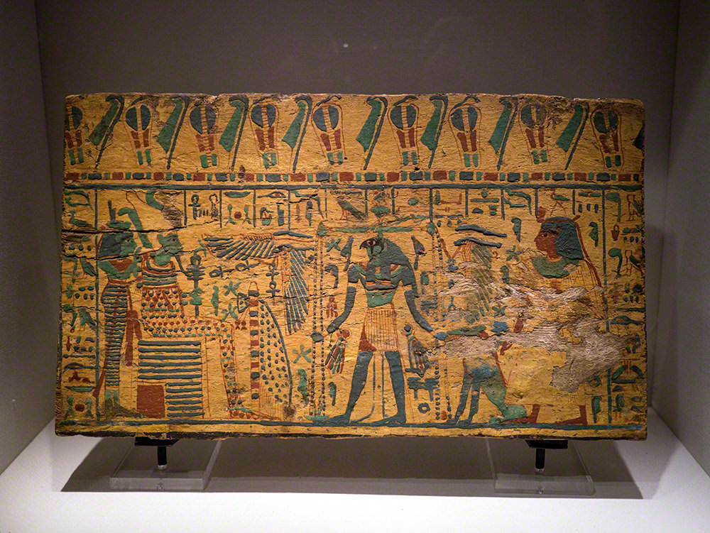 A coffin panel similar to the others, with gods, the deceased person and lots of hieroglyphs