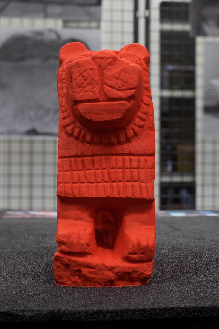 Looking straight on at the largest of the 3D-printed lions to highlight the detail of the carvings in the face (nose, mouth and whiskers) as well as the stylised mane and criss-cross pattern across the chest