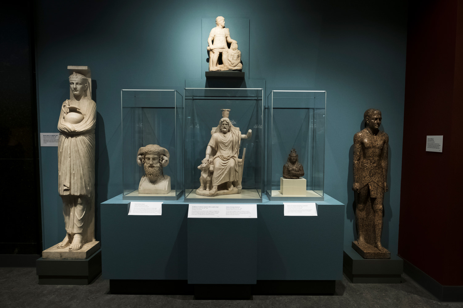 A collection of Greco-Roman sculptures of Egyptian pharaohs and deities