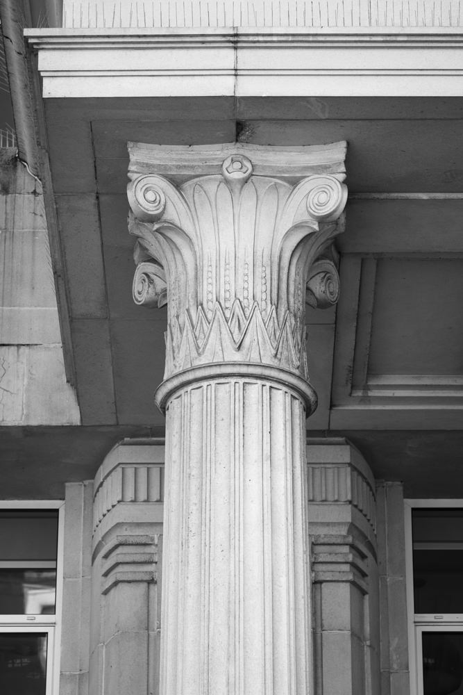 The capital of a column, carved with a mixture of ancient Egyptian and ancient Greek architectural elements