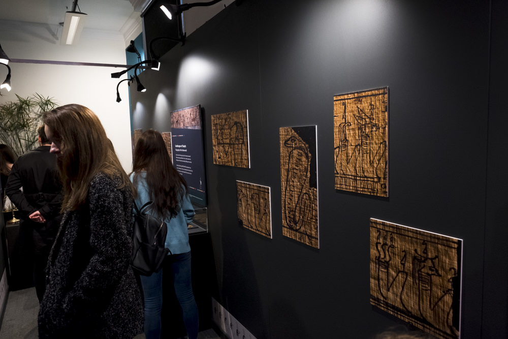 Macro photos of details from the Egyptian book of the dead printed out at extra large sizes on a museum wall