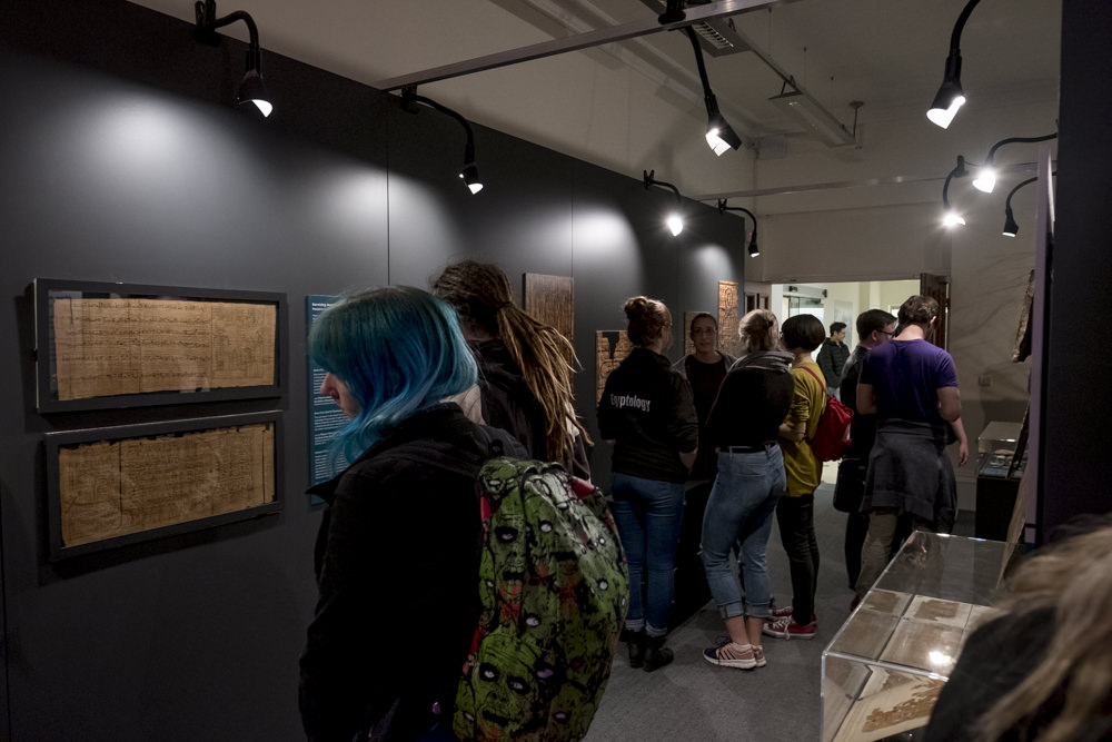 People visiting an exhibition of ancient Egyptian artefacts