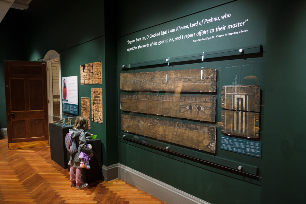 The wall of an exhibition room with ancient Egyptian coffin panels