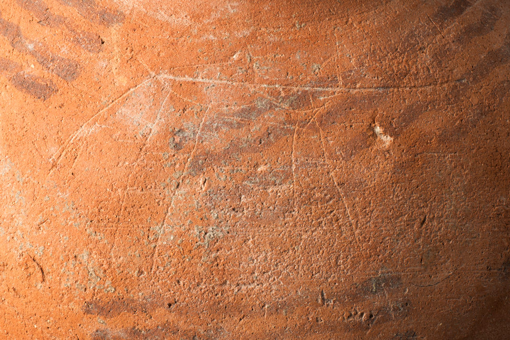 Scratch marks on an Egyptian Predynastic pot