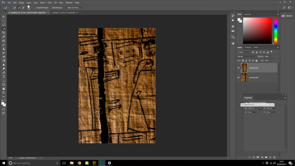 ancient Egyptian papyrus being 'repaired' in Photoshop