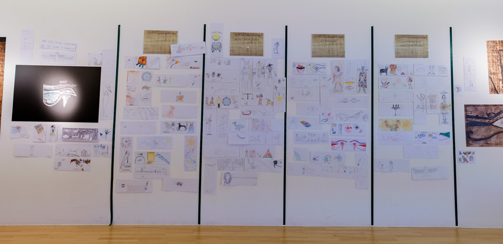 A wall covered in drawings