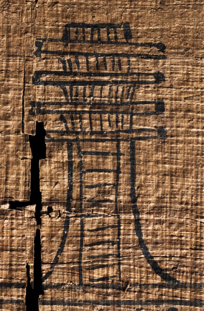 an egyptian djed pillar on papyrus