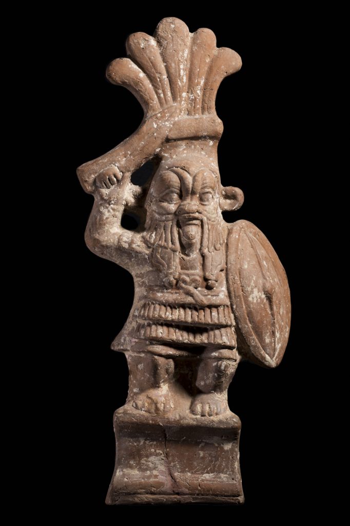 ancient egyptian god bes dressed in a soldier's uniform