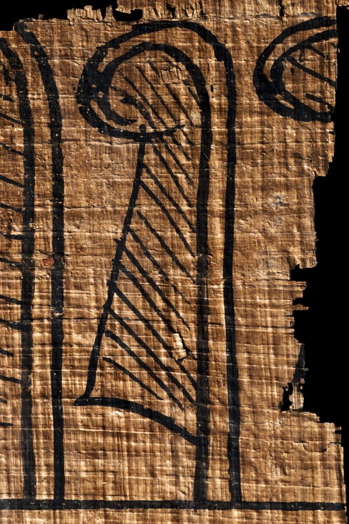 an egyptian feather of truth on papyrus