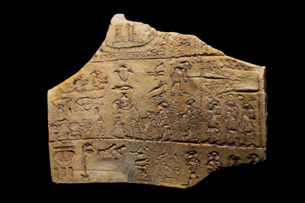 an ancient egyptian ivory label with hieroglyphs