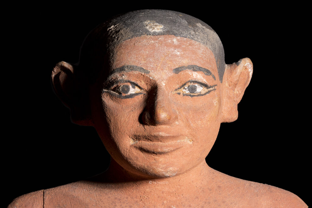 the head of an ancient egyptian statuette of a man