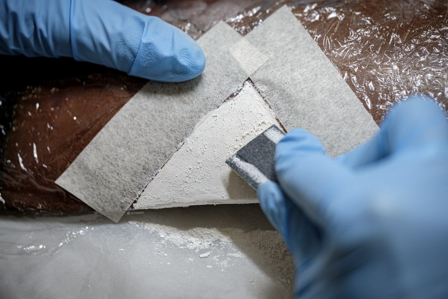 a conservator working on ancient egyptian pottery