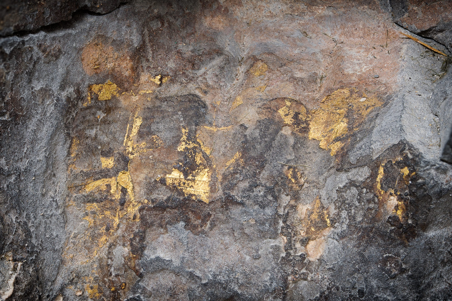 traces of gold leaf on a statue of the ancient egyptian goddess hathor