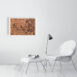 product image of the 41 by 61 cm woman offering incense photo print on a wall next to a chair and foot rest