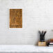 product image of the 20 by 30 cm re and mehen photo print on a wall next to a chair and foot rest