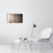 product image of the 41 by 61 cm re-horakhty and osiris photo print on a wall next to a chair and foot rest