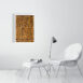 product image of the 41 by 61 cm re and mehen photo print on a wall next to a chair and foot rest