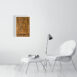 product image of the 41 by 61 cm re and mehen photo print on a wall next to a chair and foot rest