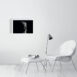 product image of the 41 by 61 cm re and mehen photo print on a wall next to a chair and foot rest