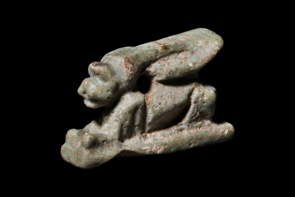 An ancient Egyptian amulet of a recumbant hare.